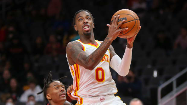 Atlanta Hawks guard Delon Wright shoots a layup against the Denver Nuggets.
